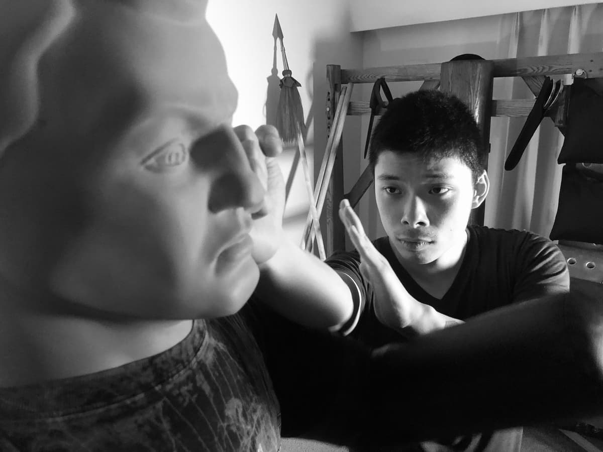 Wing Chun training adjustments with a student